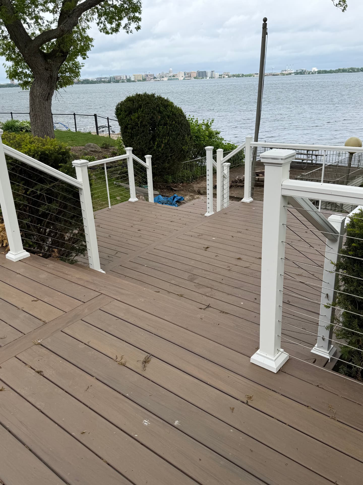 Composite deck with white cable railing overlooking the lake in Madison WI